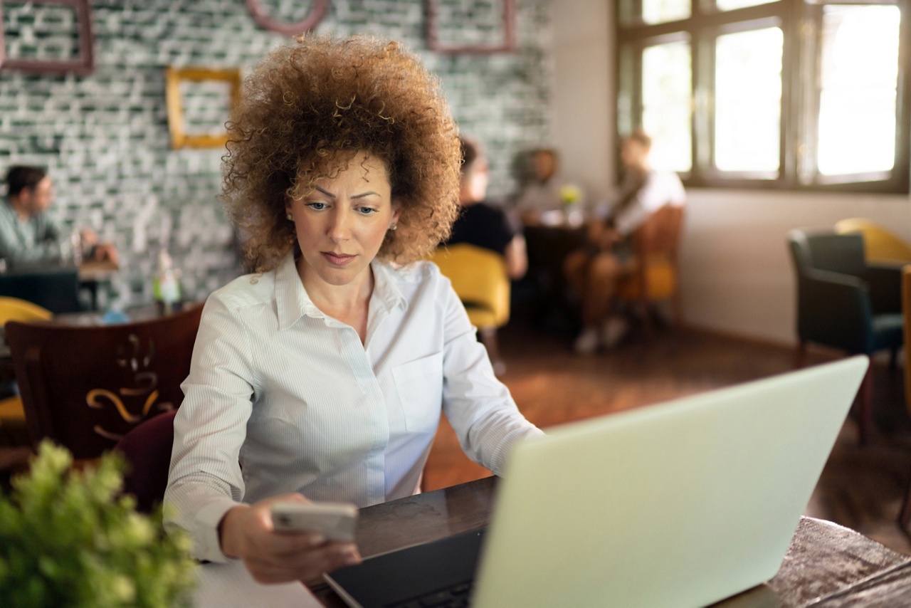 Photo of a woman working in a coffee shop for an article about changes to the global financial system