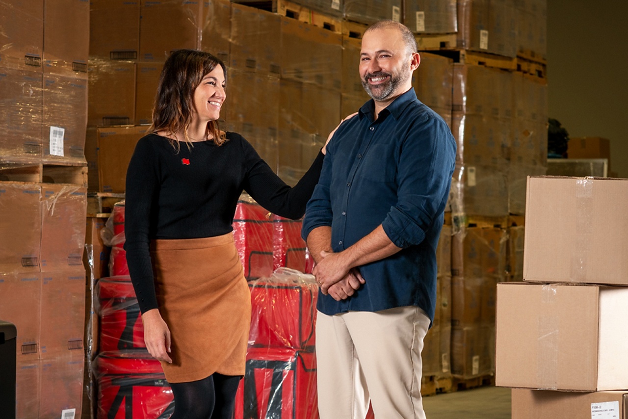 Photo of a National Bank advisor and their client speaking about business growth in a health and safety equipment store 