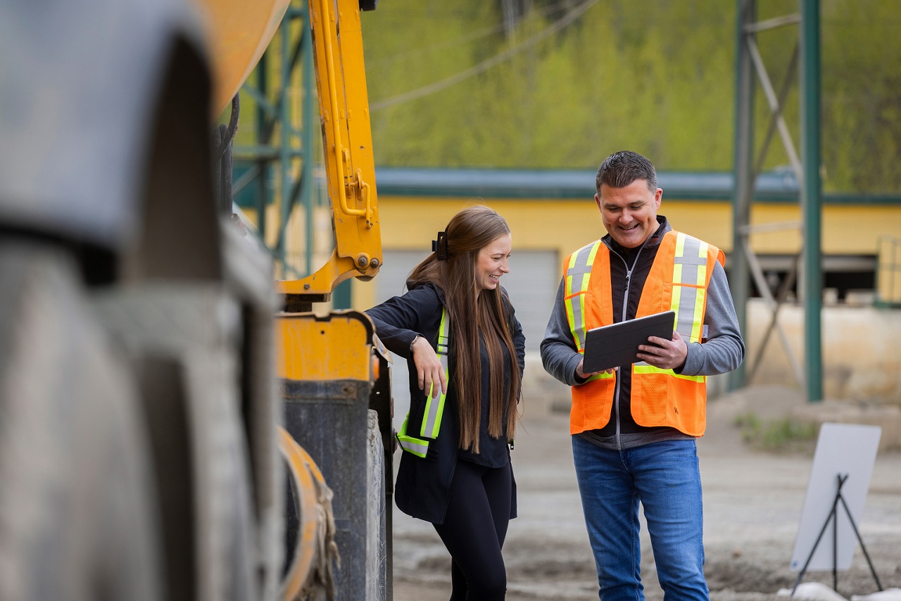Photo of two people working with their equipment that they leased or financed through National Bank