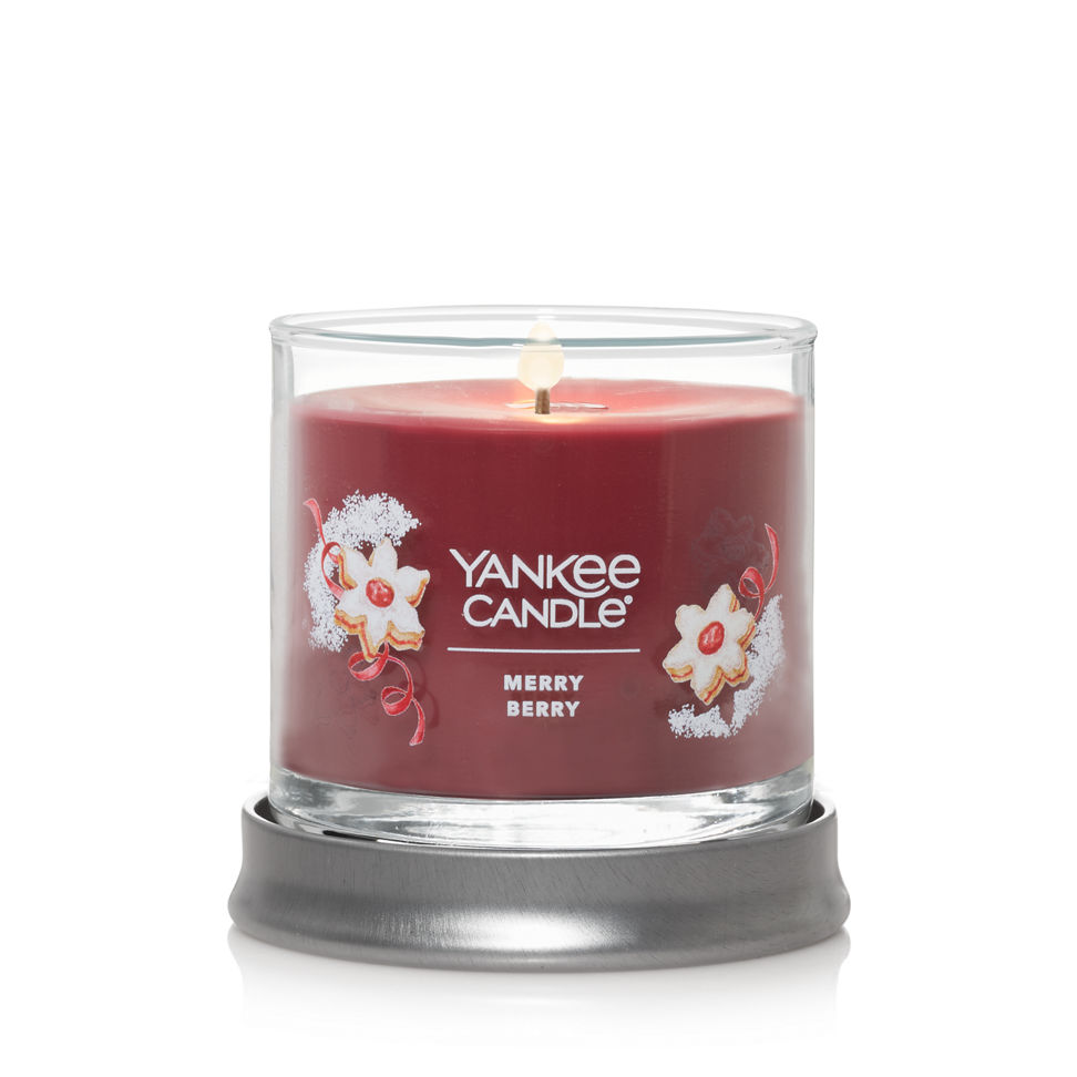 signature merry berry small tumbler candle lit with lid as coaster