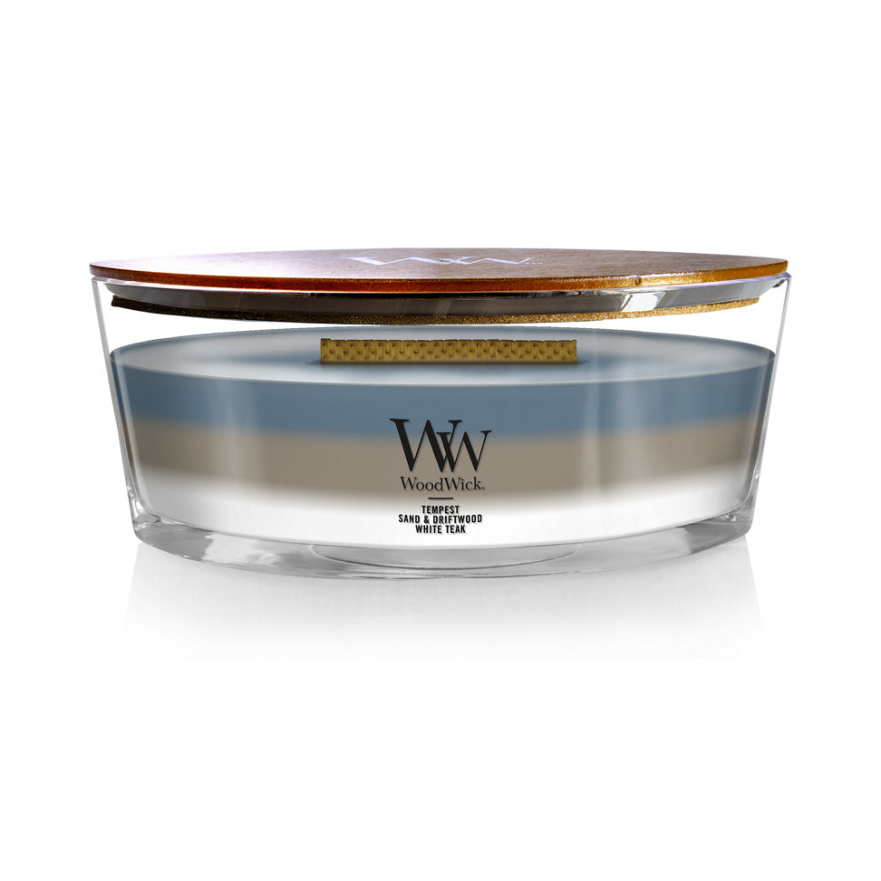 woodwick unchartered waters ellipse trilogy candle featuring layered scents of tempest, sand & driftwood, and white teak