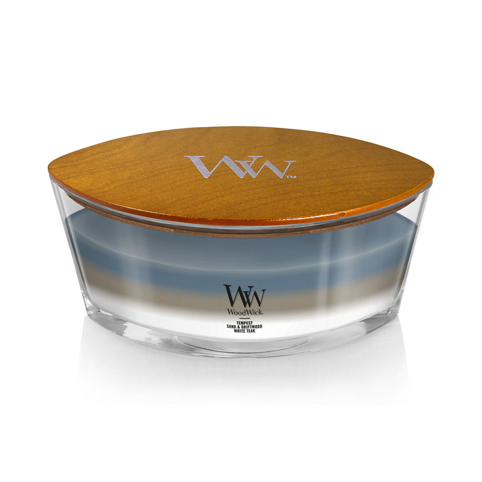 woodwick unchartered waters ellipse trilogy candle featuring layered scents of tempest, sand & driftwood, and white teak
