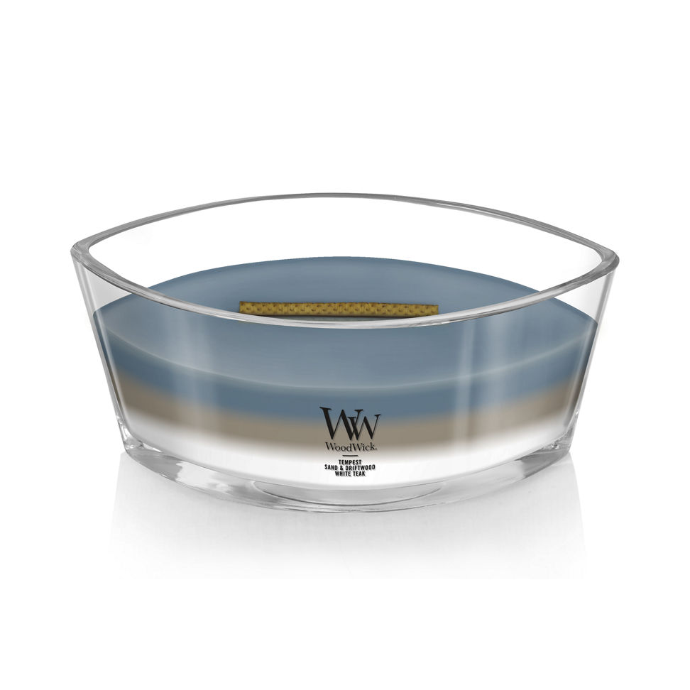 woodwick unchartered waters ellipse trilogy candle featuring layered scents of tempest, sand & driftwood, and white teak
