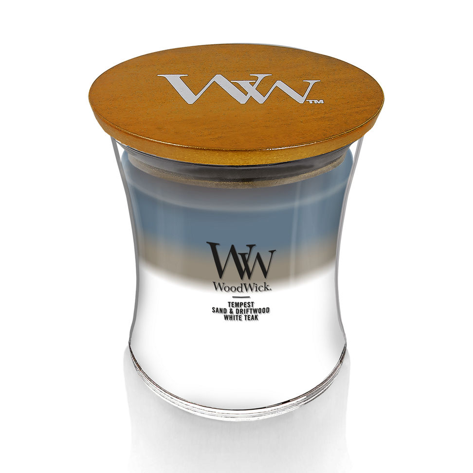 woodwick unchartered waters medium hourglass trilogy candle featuring layered scents of tempest, sand & driftwood, and white teak