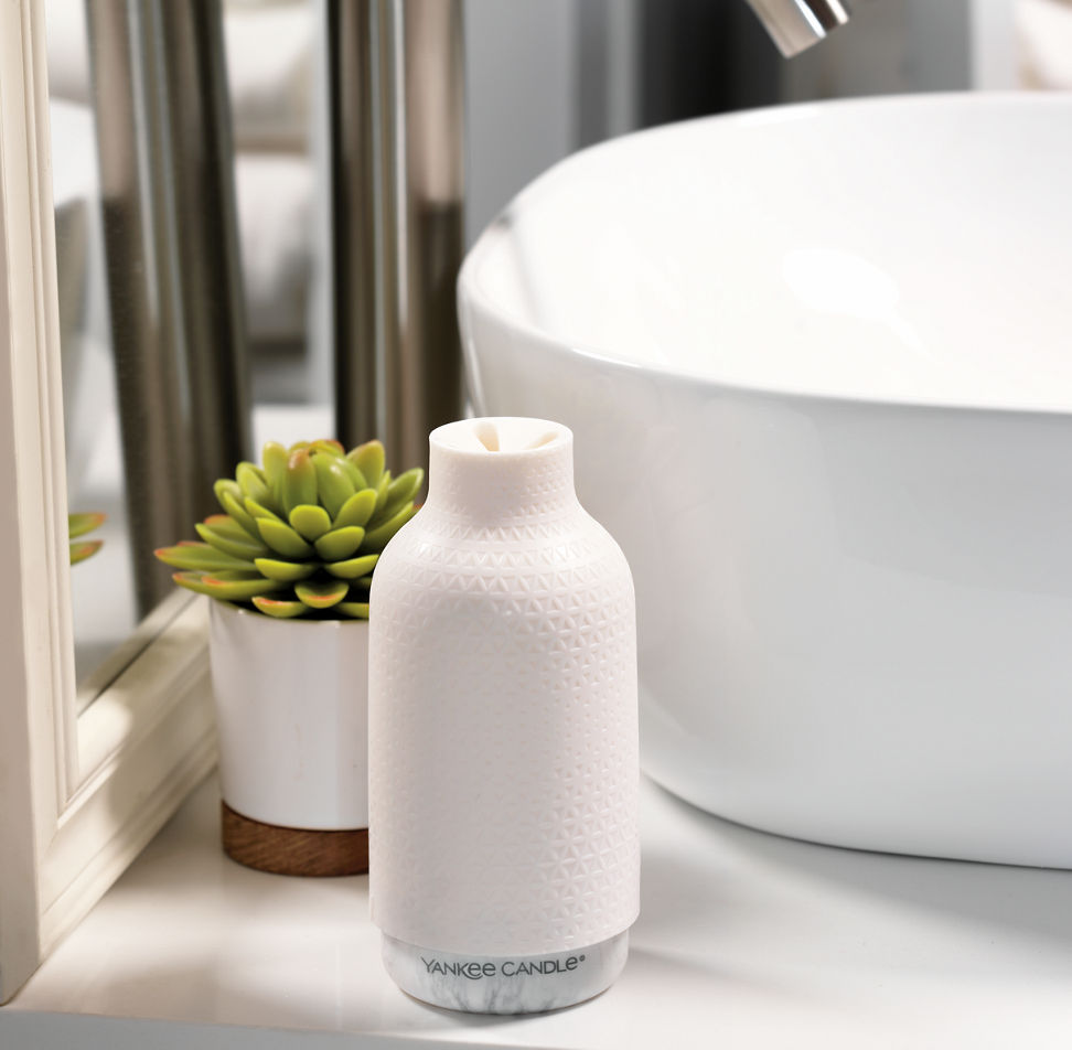 clean cotton fragrance dispenser on table