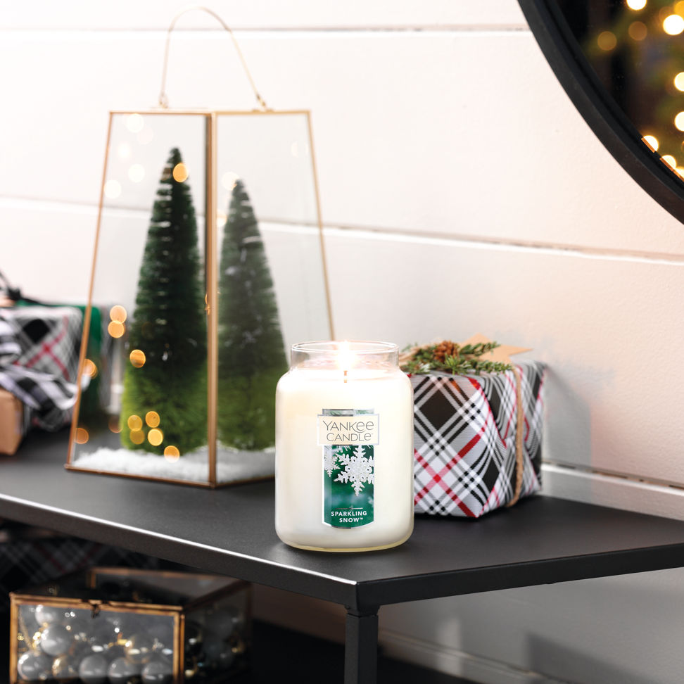 sparkling snow original large jar candle on table with gifts