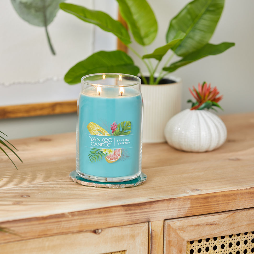 bahama breeze signature large jar candle on table