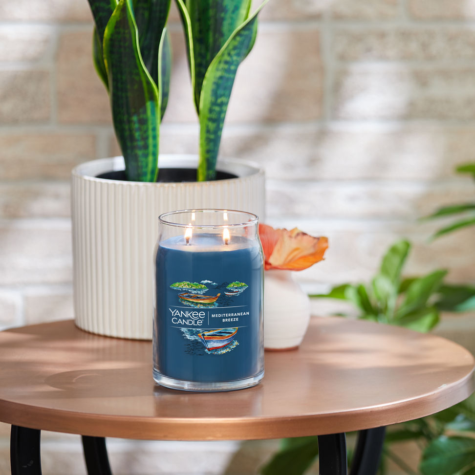 mediterranean breeze signature large jar candle on table