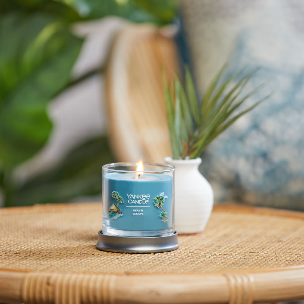 beach escape signature small tumbler candle on table