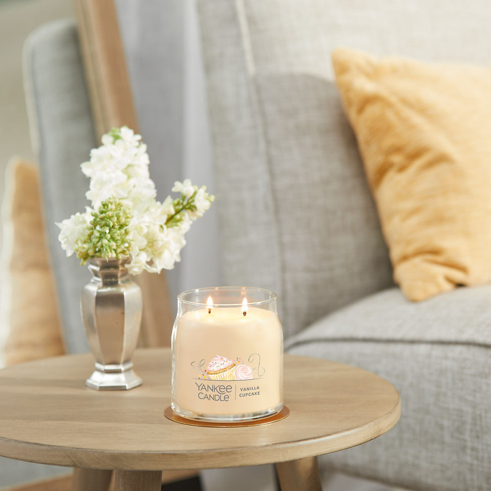 vanilla cupcake signature medium jar candle on table