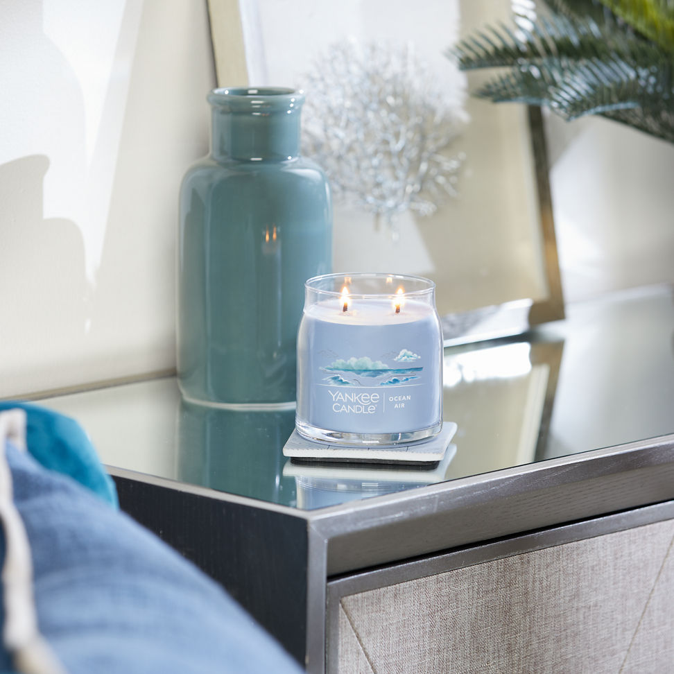 ocean air signature medium jar candle on table