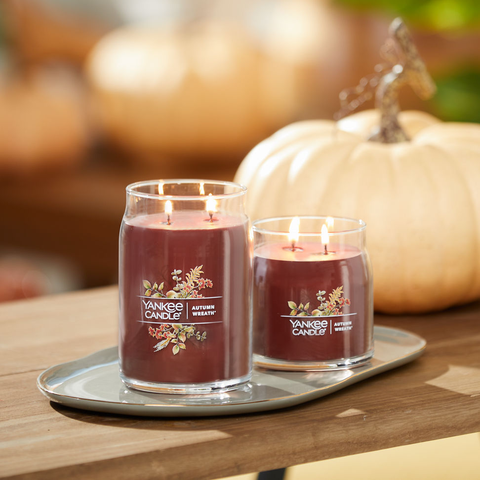 autumn wreath signature large and medium jar candles on table