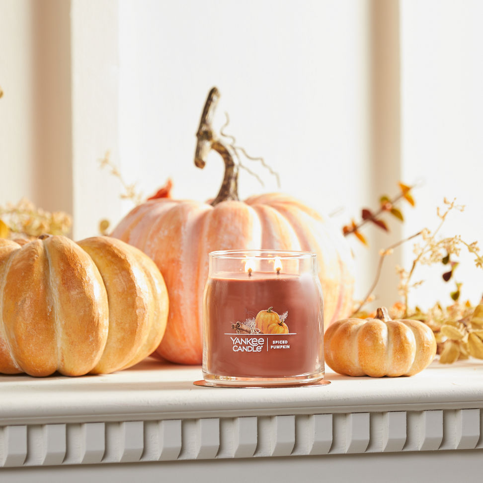 spiced pumpkin signature medium jar candle on mantle