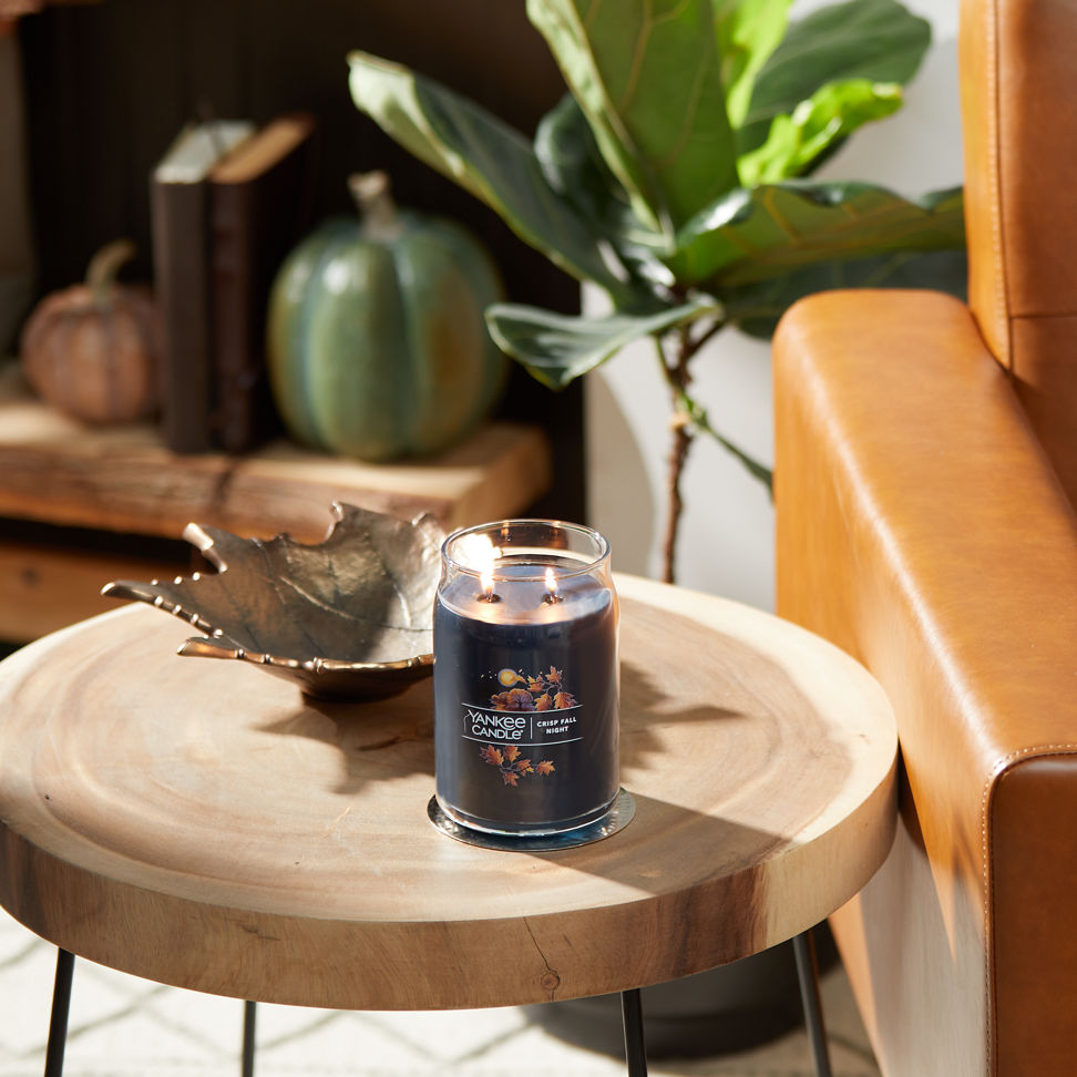 crisp fall night signature large jar candle on table