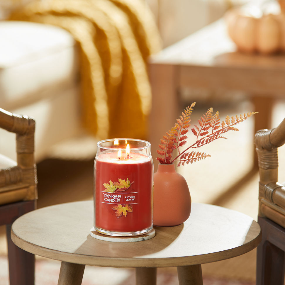autumn leaves signature large jar candle on table