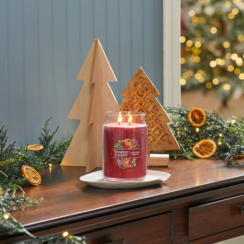 red apple wreath signature large jar candle on desk