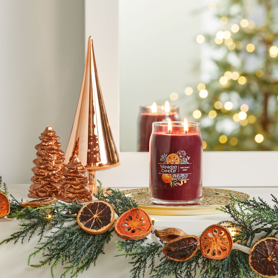 holiday zest signature large jar candle on mantle