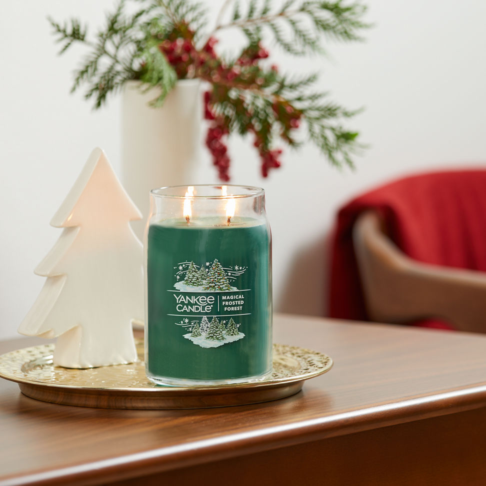 magical frosted forest signature large jar candle on table