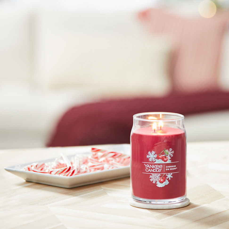 cherries on snow signature large jar candle on table