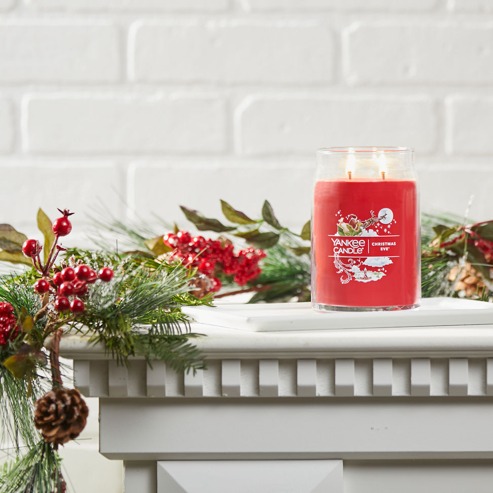 christmas eve signature large jar candle on mantle
