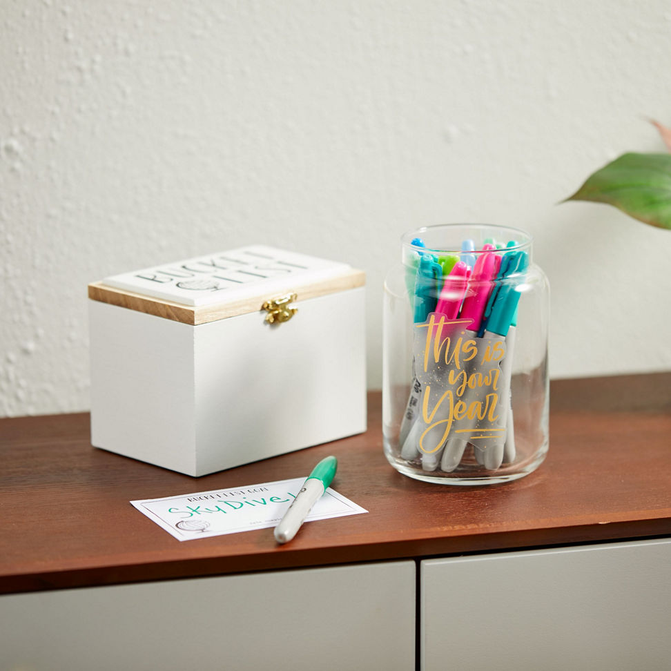 original large jar candle upcycled into container holding sharpie markers