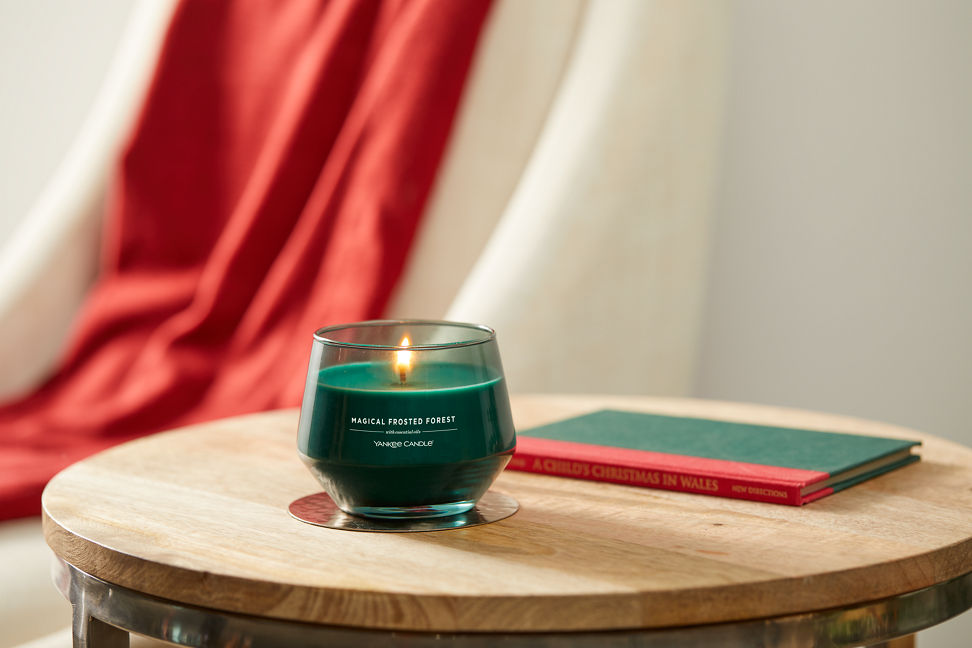 magical frosted forest studio collection jar candle on wooden accent table