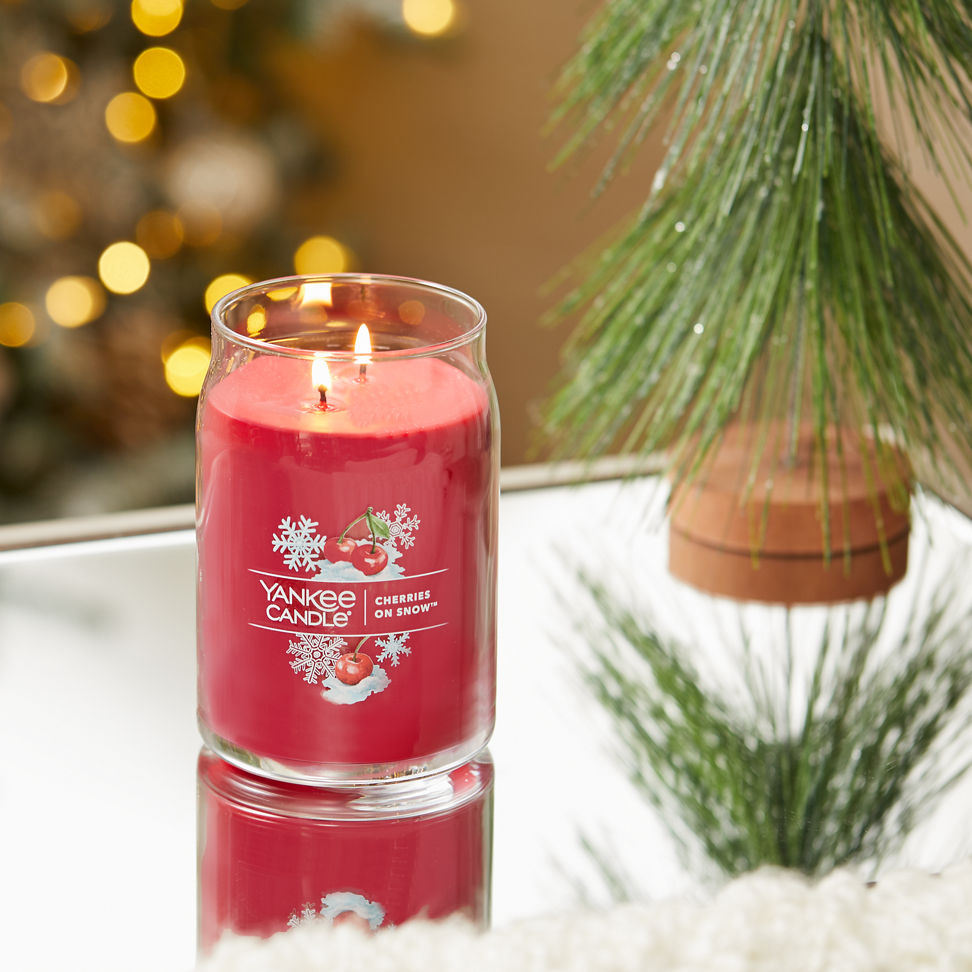 cherries on snow signature large jar candle on table