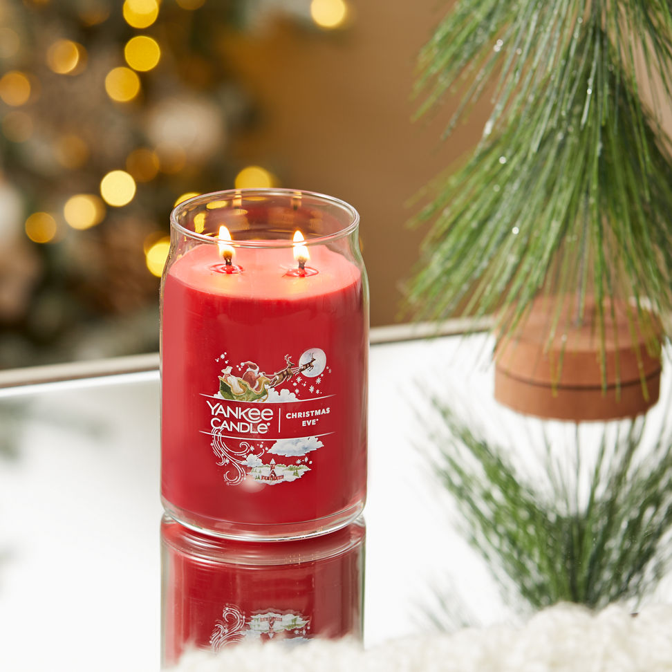 christmas eve signature large jar candle on table