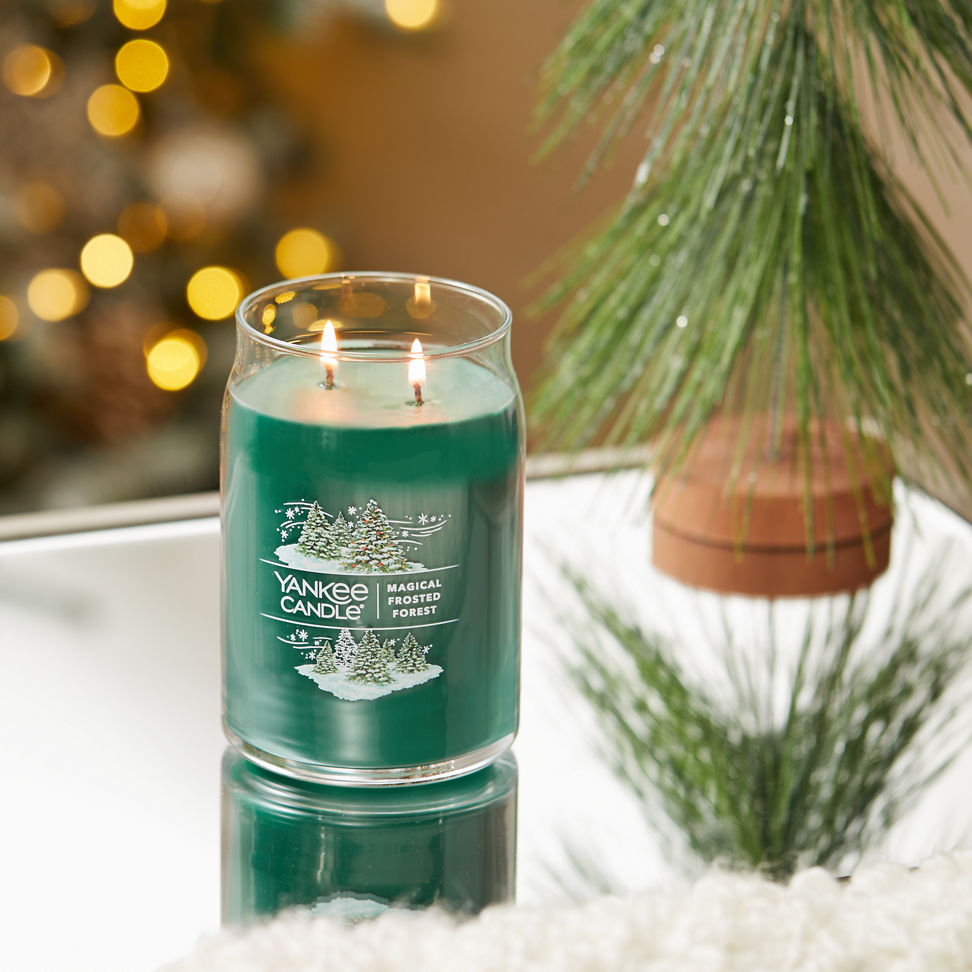 magical frosted forest signature large jar candle on table