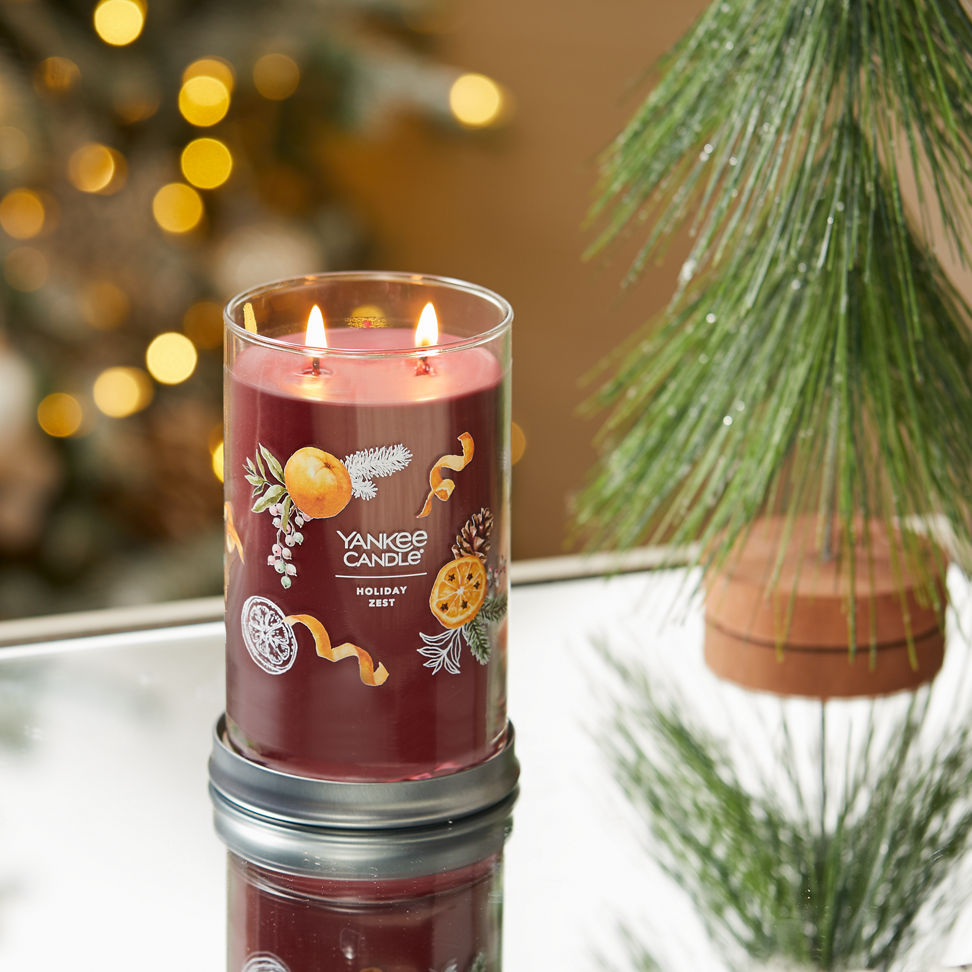 holiday zest signature large tumbler candle on table