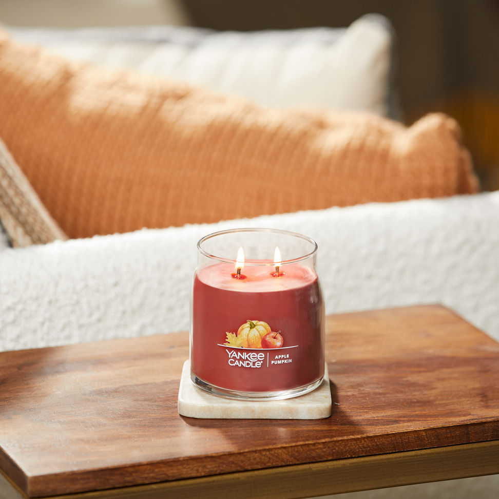 apple pumpkin signature medium jar candle on table