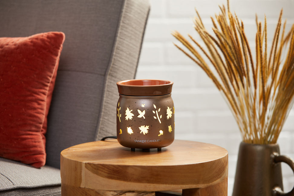 dancing leaves wax melt warmer on table