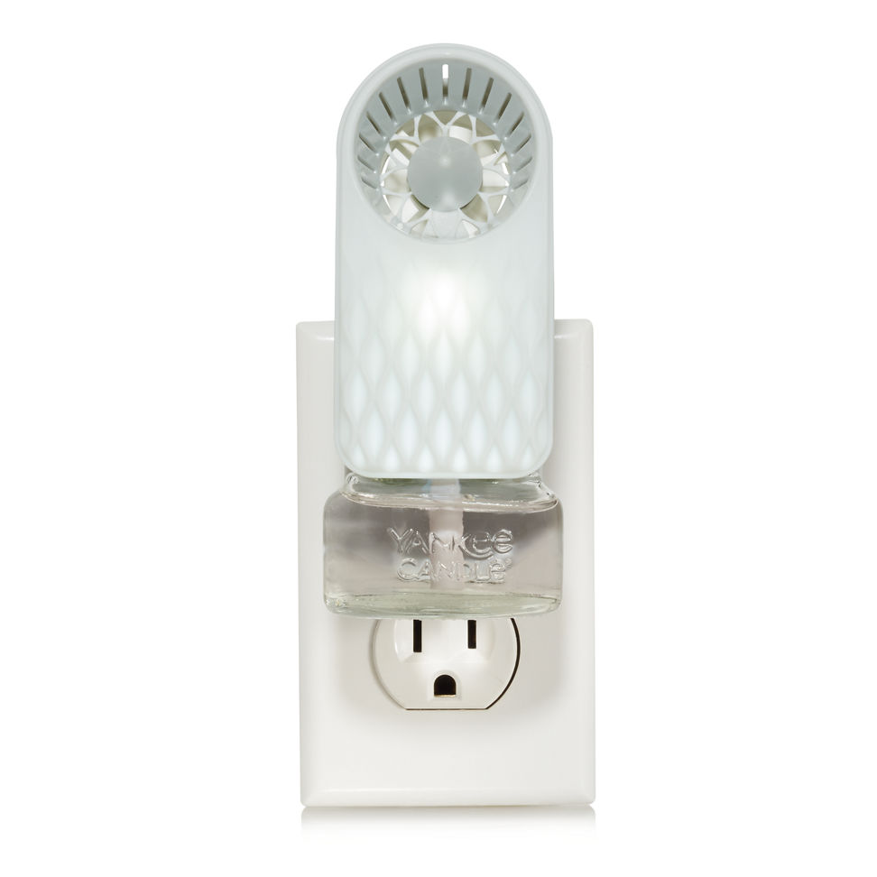 scentplug fan with diamond fade pattern and light with scentplug refill in outlet