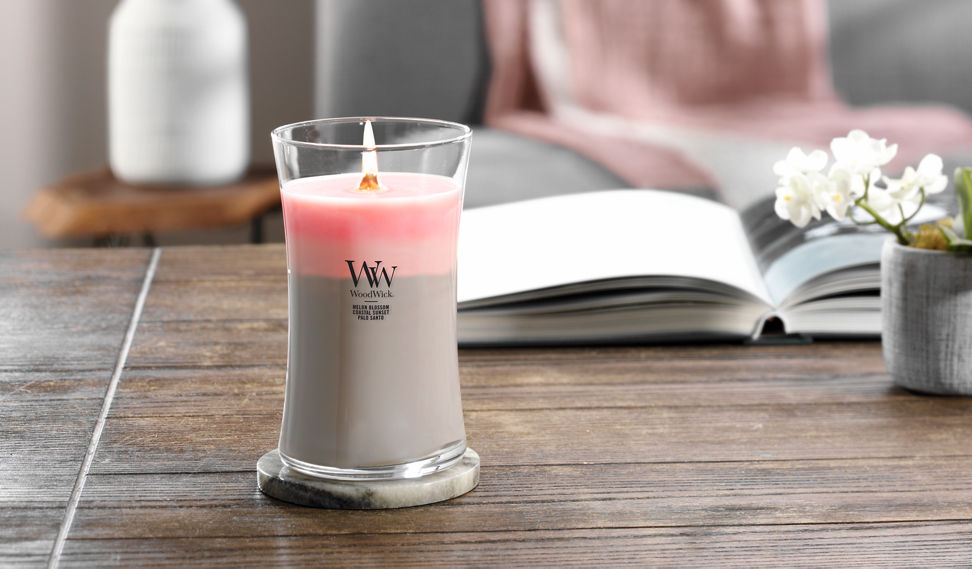 melon blossom and coastal sunset and palo santo trilogy large jar candle on lid