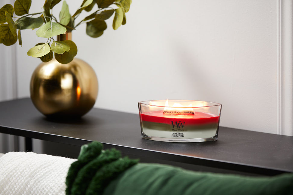woodwick winter garland trilogy ellipse candle on shelf