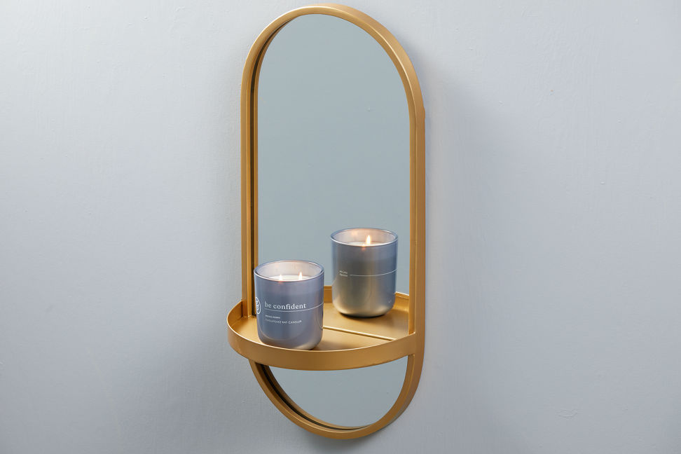 chesapeake bay candle intentions collection be confident indigo poppy medium two wick jar candle on a sconce