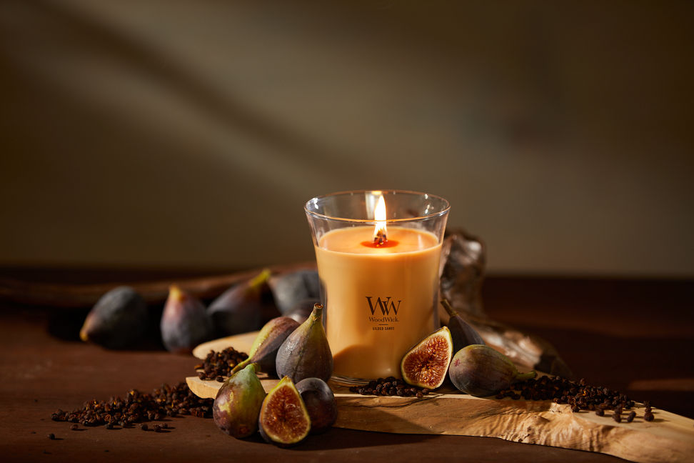 WoodWick Enchanted Destinations Collection Gilded Sands Medium Hourglass Candle on a table