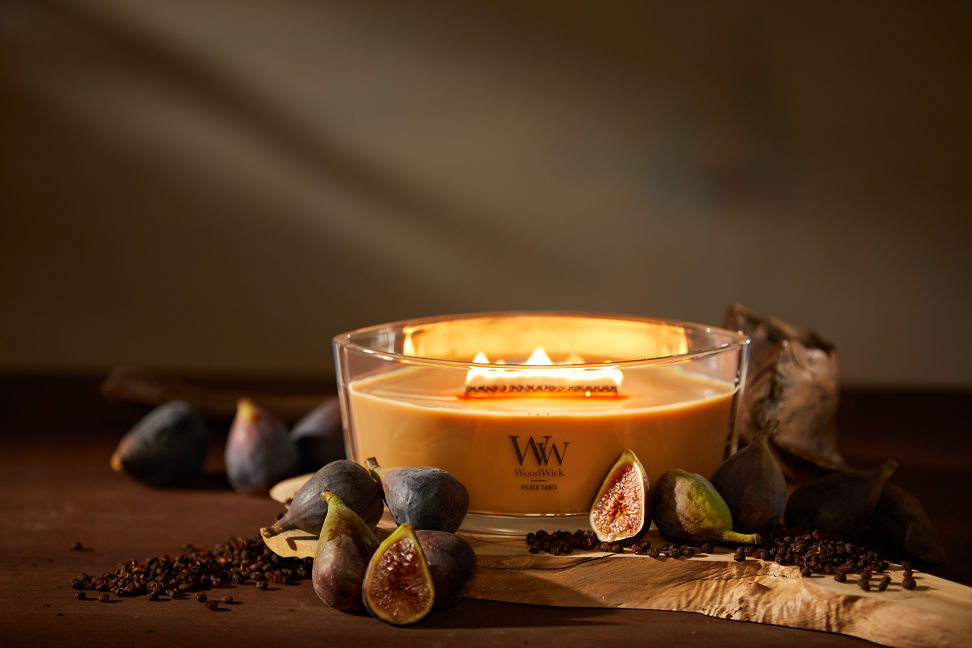 WoodWick Enchanted Destinations Collection Gilded Sands Ellipse Candle on a table