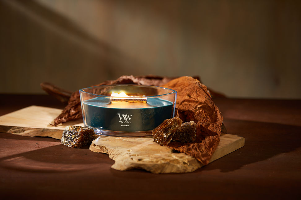WoodWick Enchanted Destinations Collection Antiquarium Ellipse Candle on a table