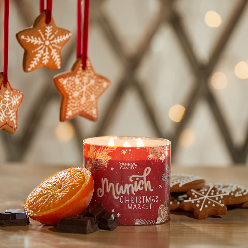 munich christmas market three wick candle with cookies, an orange, and chocolate