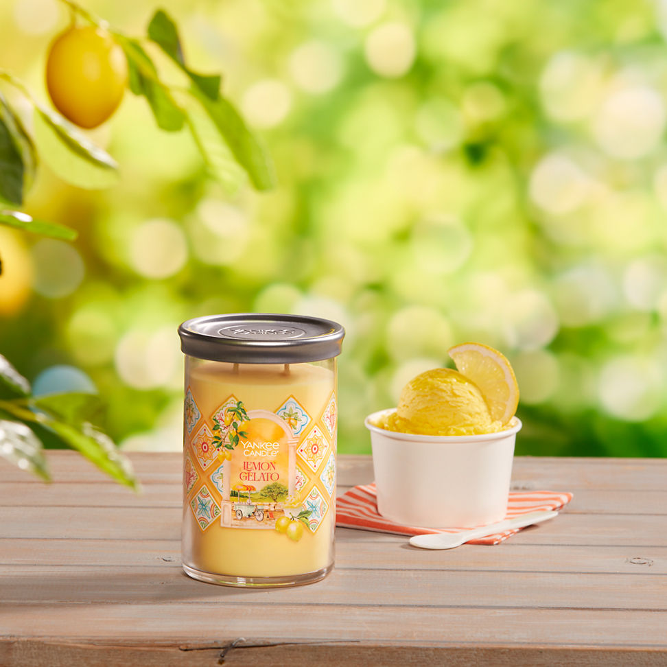 Hello, Italy! Collection Lemon Gelato Signature Large Tumbler Candle on a table with a bowl of ice cream and a spoon