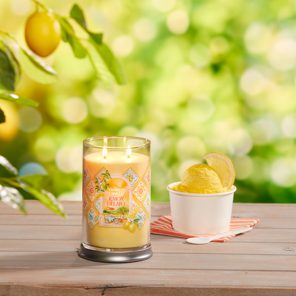 Hello, Italy! Collection Lemon Gelato Signature Large Tumbler Candle on a table with a cup of ice cream and a spoon