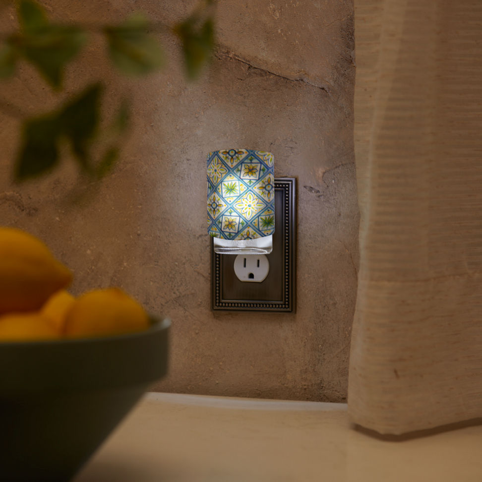 Hello, Italy Pattern ScentPlug Diffuser with a light plugged into a wall