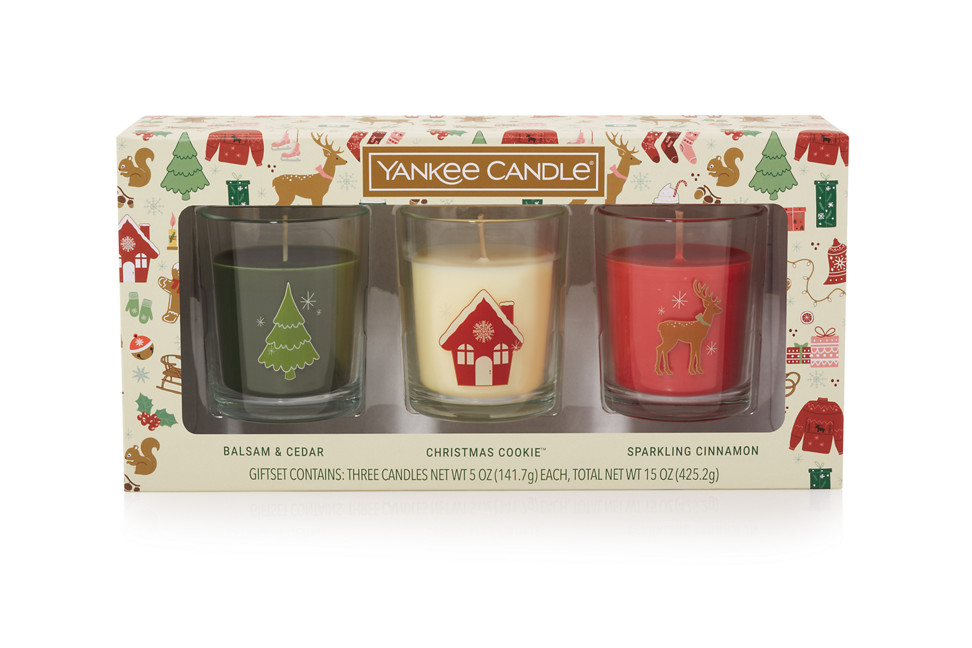 A Candle Gift Set that includes three candles one each in Balsam & Cedar, Christmas Cookie, and Sparkling Cinnamon