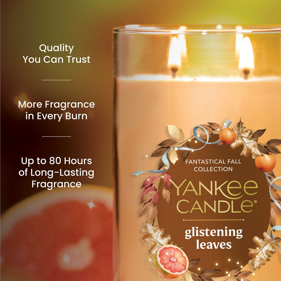 Large three-wick scented candle with fall leaves design, promises long-lasting fragrance and quality burn time.