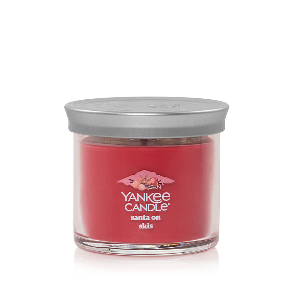 santa on skis small tumbler candle with lid