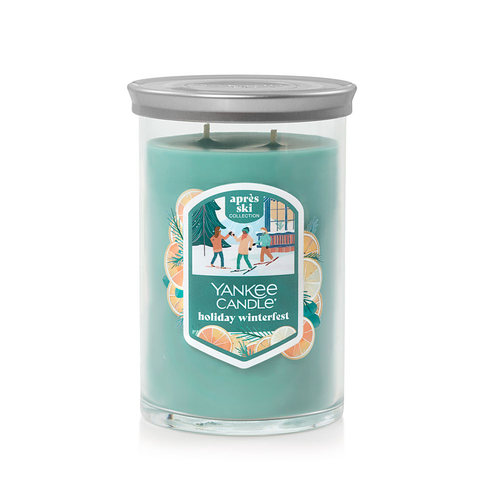 large tumbler candle with lid in holiday winterfest