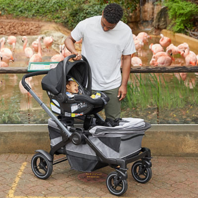 father with child in stroller