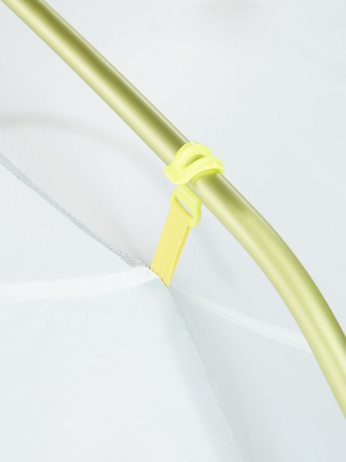 close up of tent hook around pole