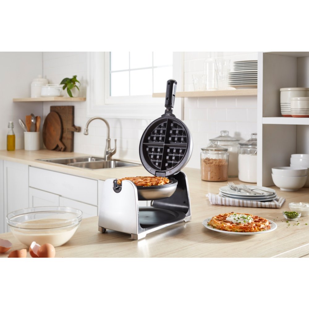 https://s7d1.scene7.com/is/image/NewellRubbermaid/2109990-oster-flip-waffle-maker-black-with-hash-brown-angle-lifestyle-1?wid=1000&hei=1000